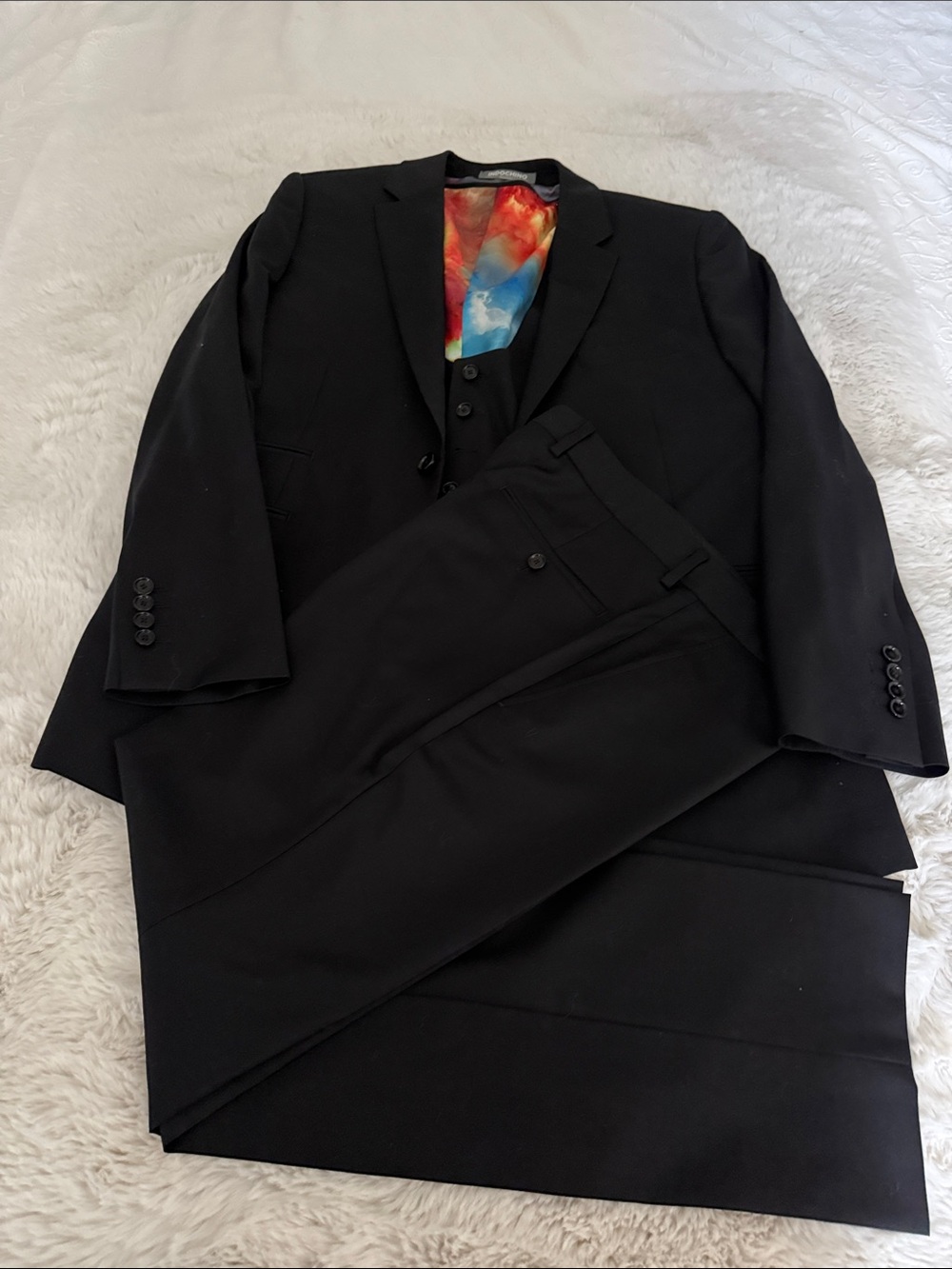 Men's Black Three-Piece Suit with Vibrant Inner Lining